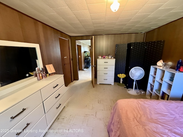 3618 Alpine Dr, Lansing, MI 48911 - bedroom featuring wooden walls and light floors