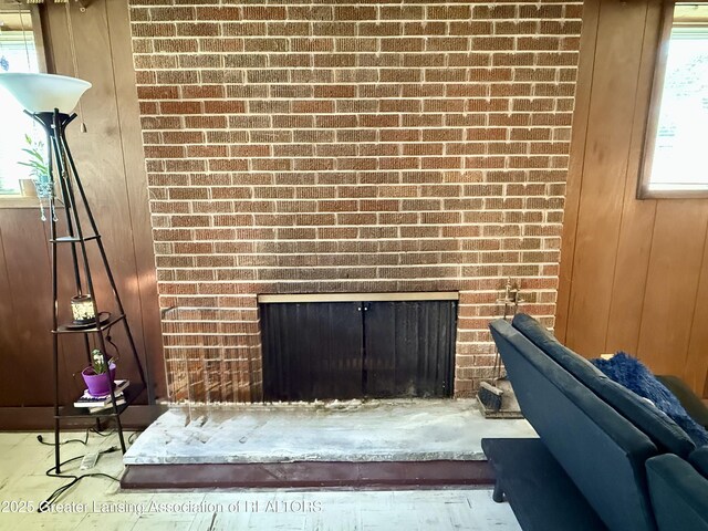 3618 Alpine Dr, Lansing, MI 48911 - detailed view of a brick fireplace, brick wall, and wood walls