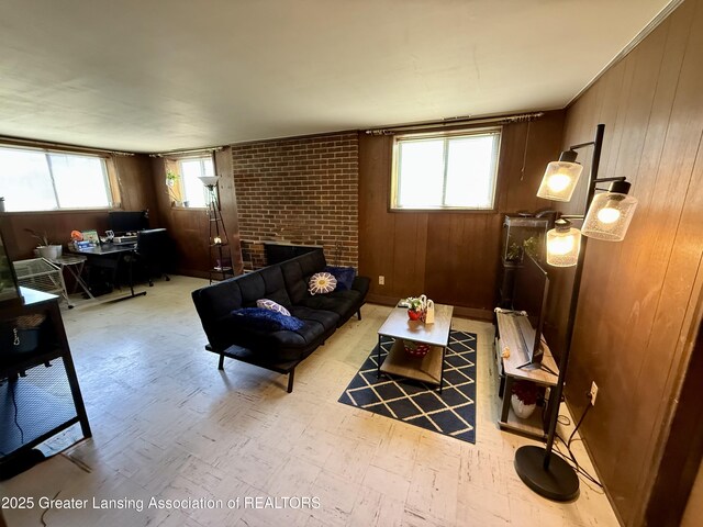 3618 Alpine Dr, Lansing, MI 48911 - living room with light floors, a desk, a fireplace, and wooden walls