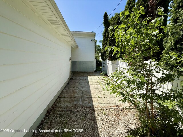 3618 Alpine Dr, Lansing, MI 48911 - view of home's exterior featuring a patio