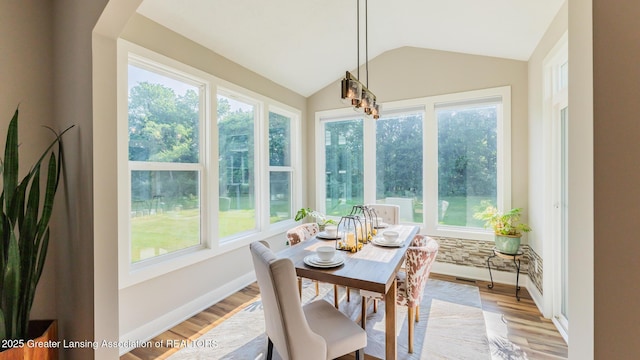 9655 Tobermory Dr, Haslett, MI 48840 - sunroom / solarium featuring healthy amount of natural light, wood finished floors, and vaulted ceiling