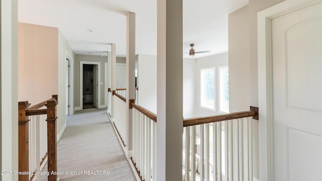 9655 Tobermory Dr, Haslett, MI 48840 - hallway featuring an upstairs landing and light colored carpet