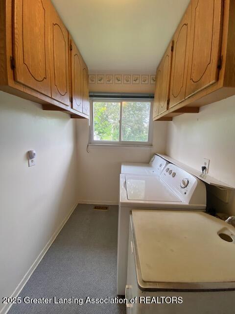 12906 Bilmar Ln, Grand Blanc, MI 48439 - laundry room featuring cabinet space, separate washer and dryer, and carpet