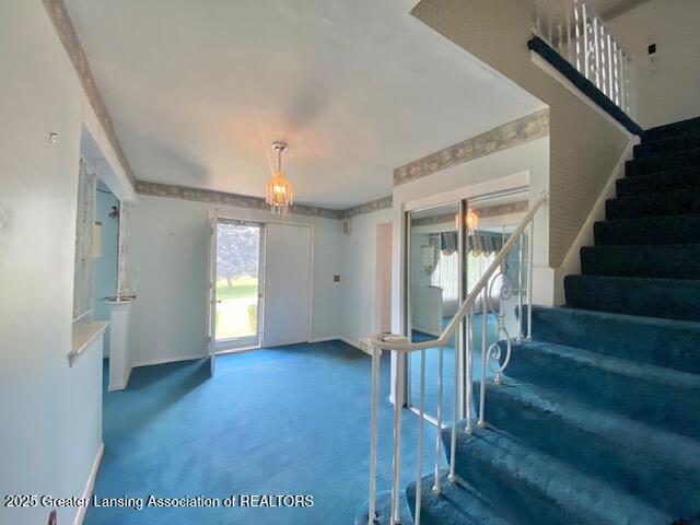 12906 Bilmar Ln, Grand Blanc, MI 48439 - unfurnished living room featuring stairs and carpet floors