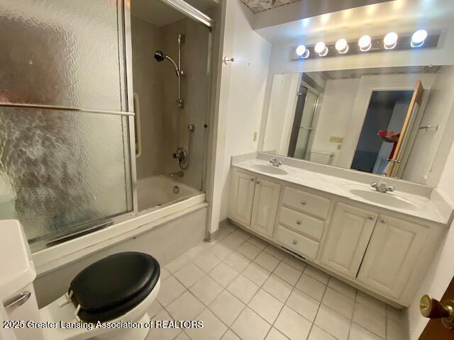 12906 Bilmar Ln, Grand Blanc, MI 48439 - bathroom featuring tile patterned floors, enclosed tub / shower combo, and double vanity
