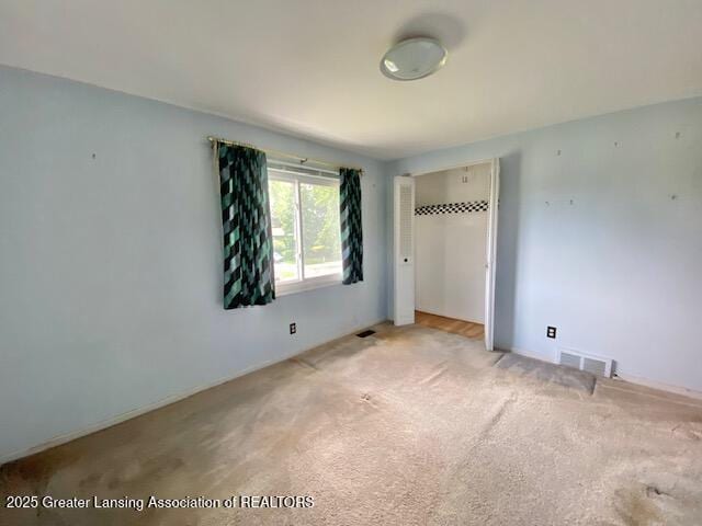 12906 Bilmar Ln, Grand Blanc, MI 48439 - unfurnished bedroom with light carpet and a closet