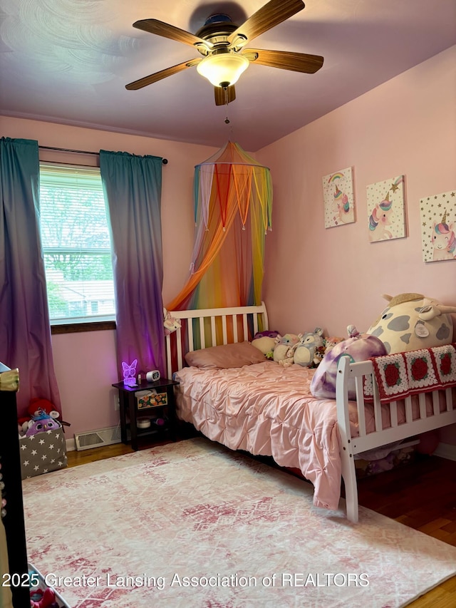 1023 E Colonial Park Dr, Grand Ledge, MI 48837 - bedroom featuring wood finished floors and a ceiling fan
