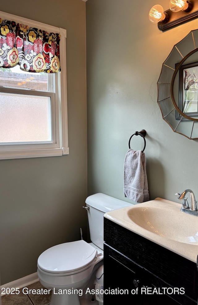 1023 E Colonial Park Dr, Grand Ledge, MI 48837 - bathroom featuring vanity and toilet
