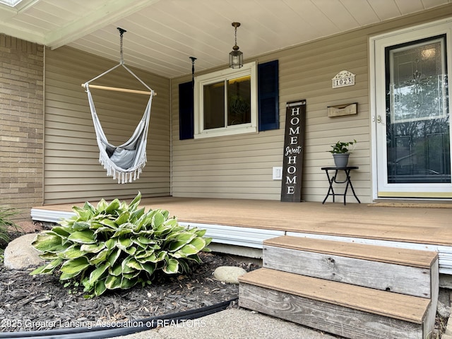 1023 E Colonial Park Dr, Grand Ledge, MI 48837 - doorway to property with covered porch