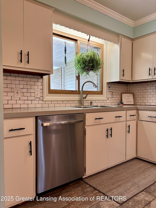 1023 E Colonial Park Dr, Grand Ledge, MI 48837 - kitchen featuring stainless steel dishwasher, ornamental molding, decorative backsplash, white cabinets, and light countertops