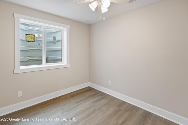 1635 Pattengill Ave, Lansing, MI 48910 - empty room with wood finished floors and a ceiling fan