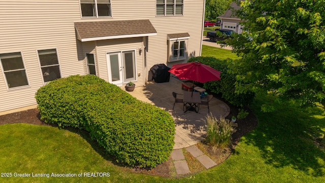 6075 Sacramento Way E, Lansing, MI 48823 - view of grassy yard featuring a patio area and french doors