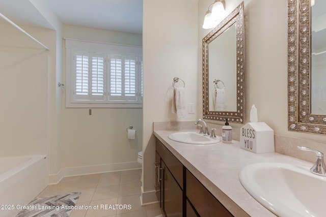6075 Sacramento Way E, Lansing, MI 48823 - full bathroom featuring tile patterned floors, double vanity, and shower / washtub combination