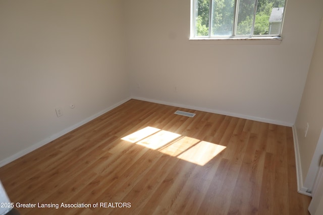 3700-3702 Malibu Dr, Lansing, MI 48911 - empty room featuring wood finished floors