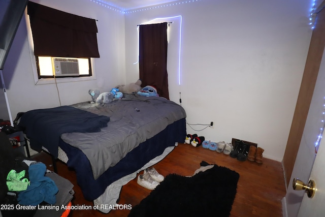3700-3702 Malibu Dr, Lansing, MI 48911 - bedroom with wood finished floors and cooling unit