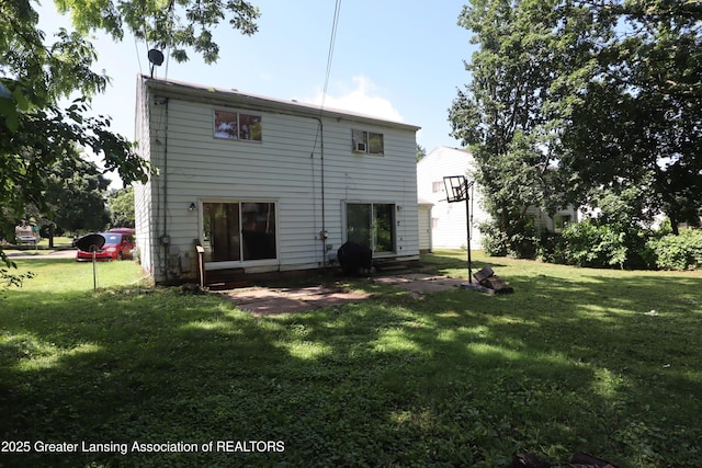3700-3702 Malibu Dr, Lansing, MI 48911 - rear view of house featuring a lawn