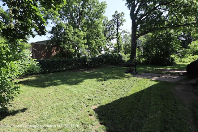 3700-3702 Malibu Dr, Lansing, MI 48911 - view of grassy yard featuring a patio