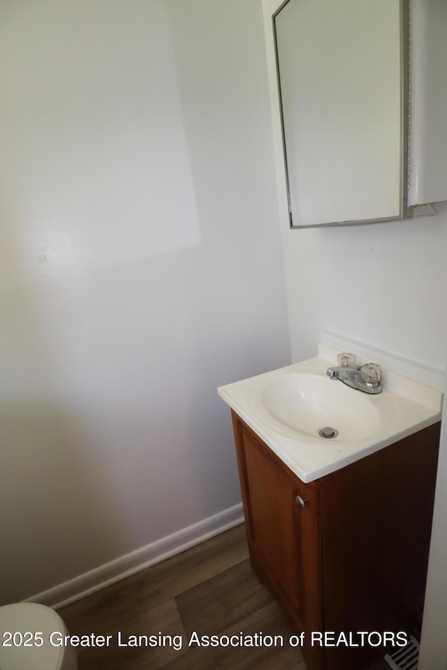 3700-3702 Malibu Dr, Lansing, MI 48911 - bathroom with vanity and wood finished floors
