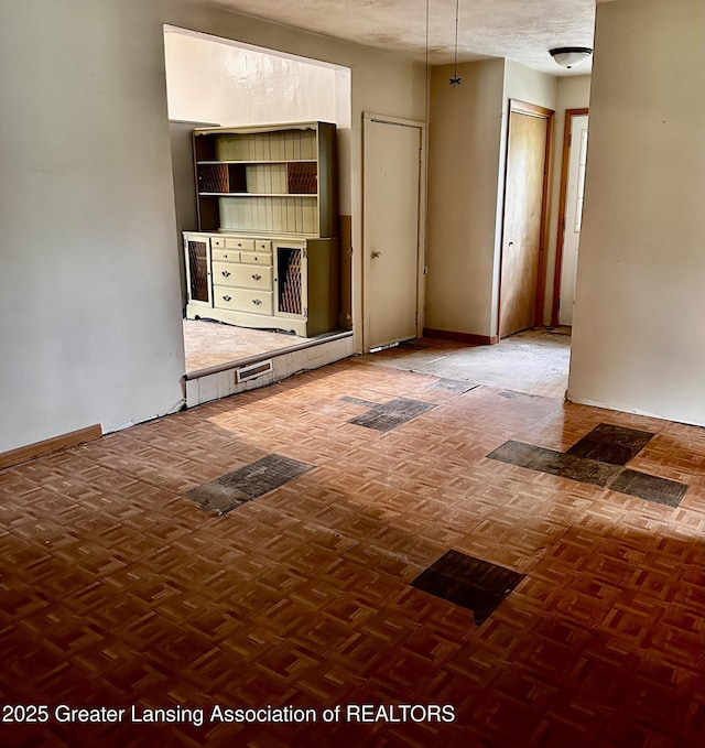 1115 Rose Ave, Big Rapids, MI 49307 - unfurnished living room featuring baseboards