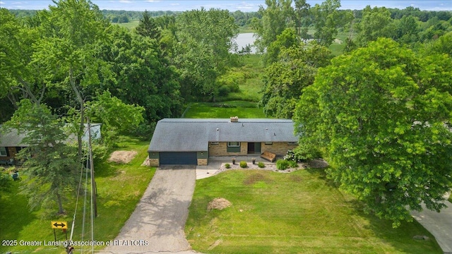 1395 Biscayne Way, Haslett, MI 48840 - aerial view of property and surrounding area featuring a forest