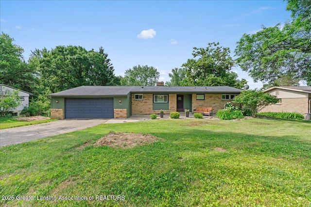 1395 Biscayne Way, Haslett, MI 48840 - single story home with brick siding, a garage, a chimney, driveway, and a front yard