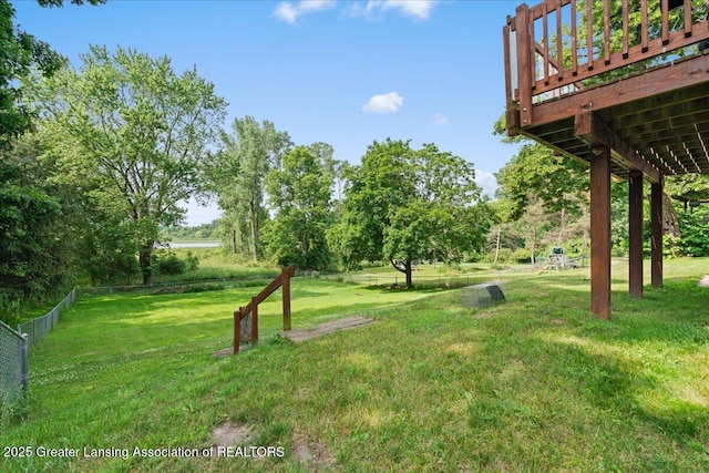 1395 Biscayne Way, Haslett, MI 48840 - view of yard with a wooden deck