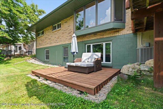 1395 Biscayne Way, Haslett, MI 48840 - rear view of house featuring a wooden deck and brick siding