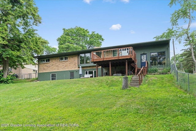 1395 Biscayne Way, Haslett, MI 48840 - back of property with stairway, a wooden deck, and a fenced backyard
