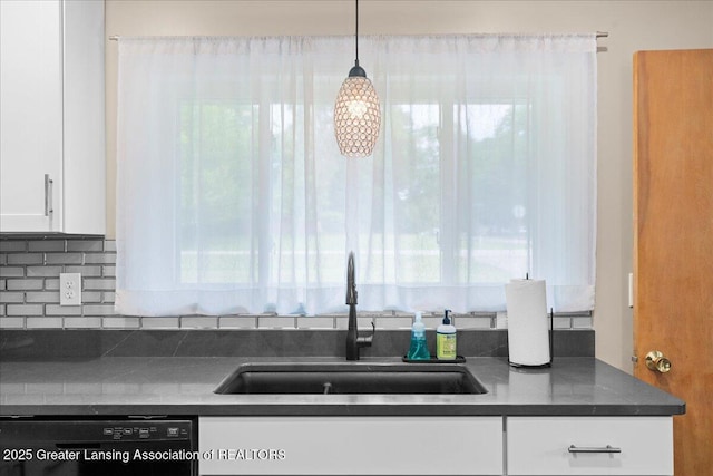 1395 Biscayne Way, Haslett, MI 48840 - kitchen with dishwasher, dark countertops, white cabinets, and plenty of natural light
