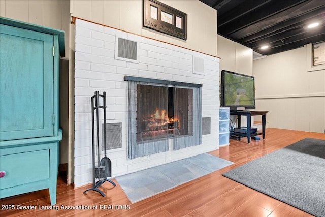 1395 Biscayne Way, Haslett, MI 48840 - living room with wood finished floors and a brick fireplace