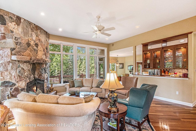 10696 W Clark Rd, Eagle, MI 48822 - living area featuring ceiling fan, wood finished floors, a fireplace, and recessed lighting