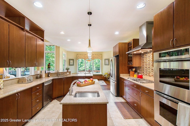 10696 W Clark Rd, Eagle, MI 48822 - kitchen with stainless steel appliances, wall chimney range hood, open shelves, a center island with sink, and backsplash