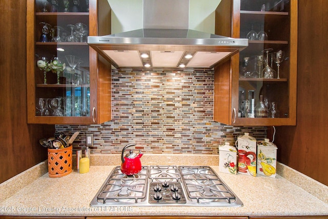 10696 W Clark Rd, Eagle, MI 48822 - bar area with wall chimney range hood, stainless steel gas stovetop, and backsplash