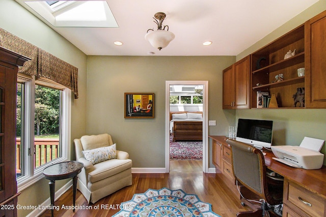 10696 W Clark Rd, Eagle, MI 48822 - office area with healthy amount of natural light, dark wood-style flooring, a skylight, and recessed lighting