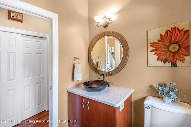 10696 W Clark Rd, Eagle, MI 48822 - bathroom with vanity and wood finished floors