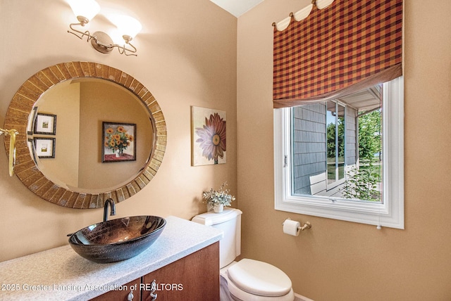 10696 W Clark Rd, Eagle, MI 48822 - half bathroom featuring toilet and vanity