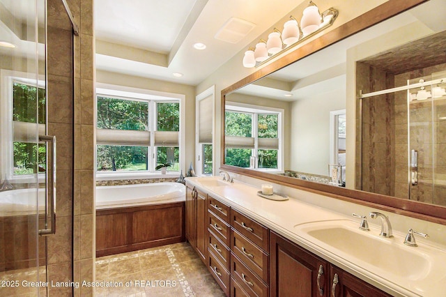 10696 W Clark Rd, Eagle, MI 48822 - bathroom featuring double vanity, a garden tub, a stall shower, tile patterned flooring, and recessed lighting