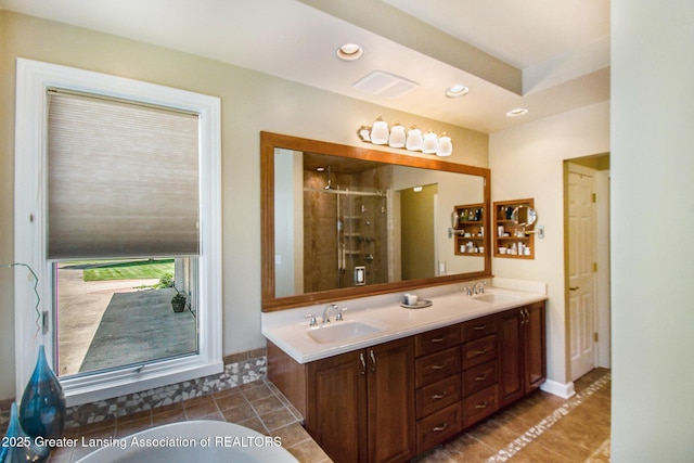 10696 W Clark Rd, Eagle, MI 48822 - bathroom featuring tile patterned flooring, double vanity, a stall shower, recessed lighting, and a tub