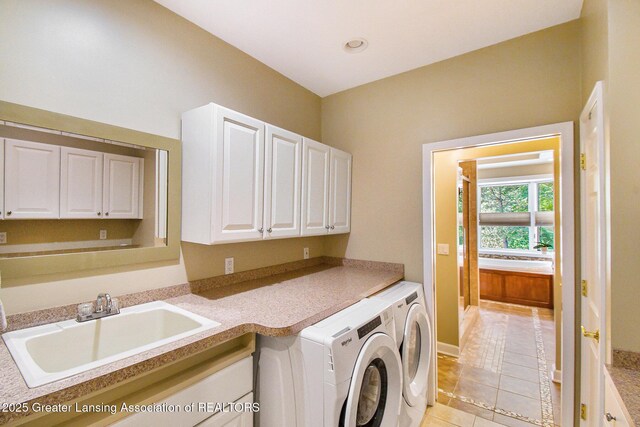 10696 W Clark Rd, Eagle, MI 48822 - laundry room featuring washing machine and clothes dryer, cabinet space, light tile patterned flooring, and recessed lighting
