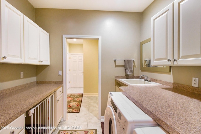 10696 W Clark Rd, Eagle, MI 48822 - laundry room featuring washing machine and clothes dryer, cabinet space, and light tile patterned flooring