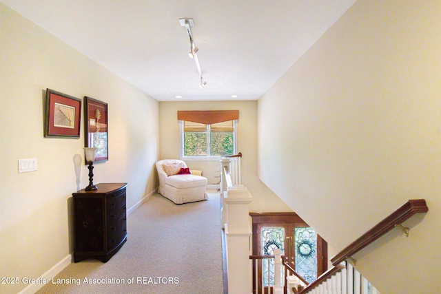10696 W Clark Rd, Eagle, MI 48822 - carpeted living room featuring track lighting and baseboards