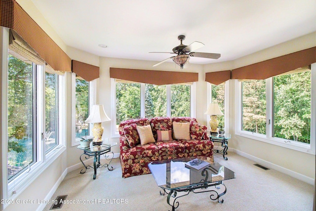 10696 W Clark Rd, Eagle, MI 48822 - sunroom featuring baseboards and carpet flooring