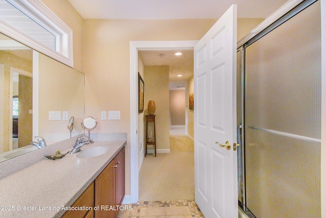 10696 W Clark Rd, Eagle, MI 48822 - bathroom with vanity, tile patterned flooring, a shower with shower door, and recessed lighting