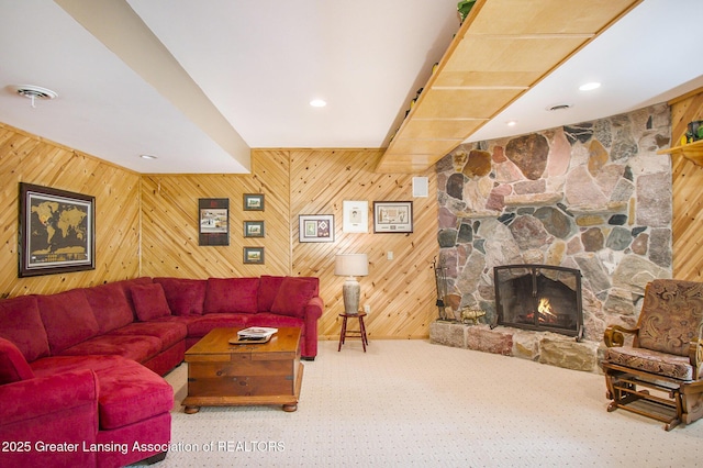 10696 W Clark Rd, Eagle, MI 48822 - living area with carpet floors, a fireplace, wooden walls, and recessed lighting