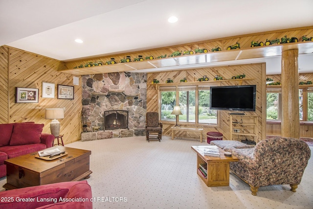 10696 W Clark Rd, Eagle, MI 48822 - living area featuring wood walls, a fireplace, carpet, and recessed lighting