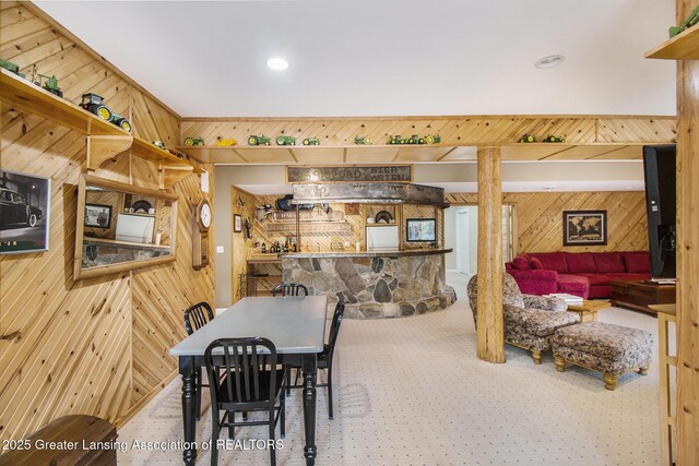 10696 W Clark Rd, Eagle, MI 48822 - carpeted dining space with wood walls