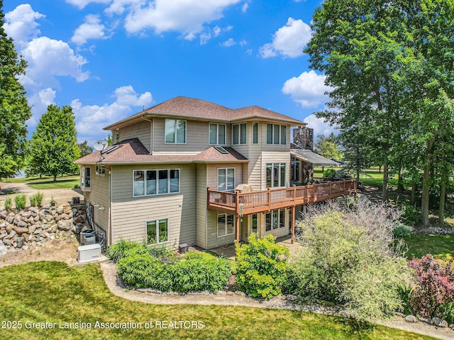 10696 W Clark Rd, Eagle, MI 48822 - back of property with a wooden deck and roof with shingles