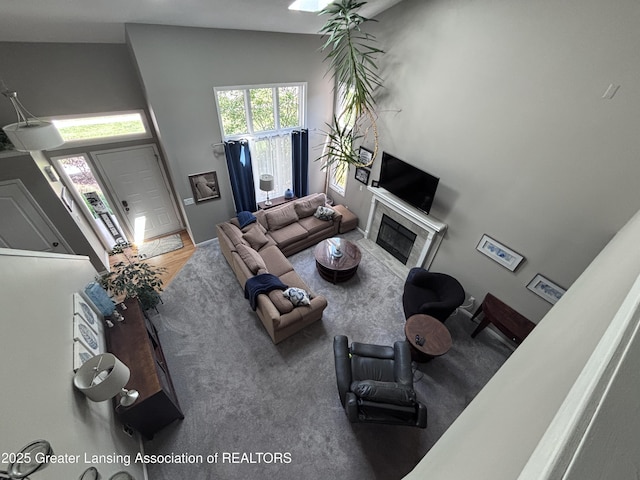 2665 Allium Dr, Holt, MI 48842 - living area featuring a tiled fireplace
