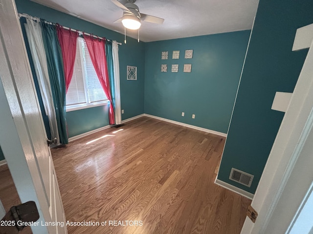 2665 Allium Dr, Holt, MI 48842 - unfurnished room featuring ceiling fan and wood finished floors