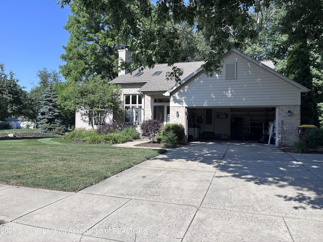 2665 Allium Dr, Holt, MI 48842 - view of front of home featuring brick siding, concrete driveway, a front yard, a garage, and a chimney